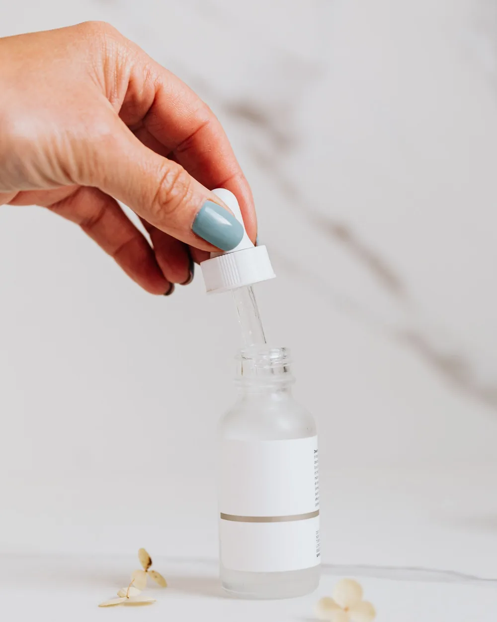 Private label facial serum in a glass dropper bottle